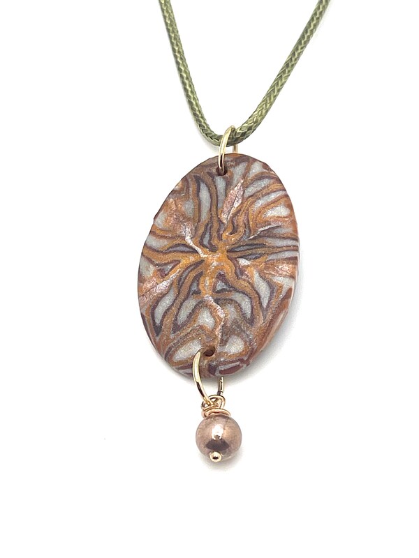 Bronze Translucent Oval Shaped pendant with golden bead